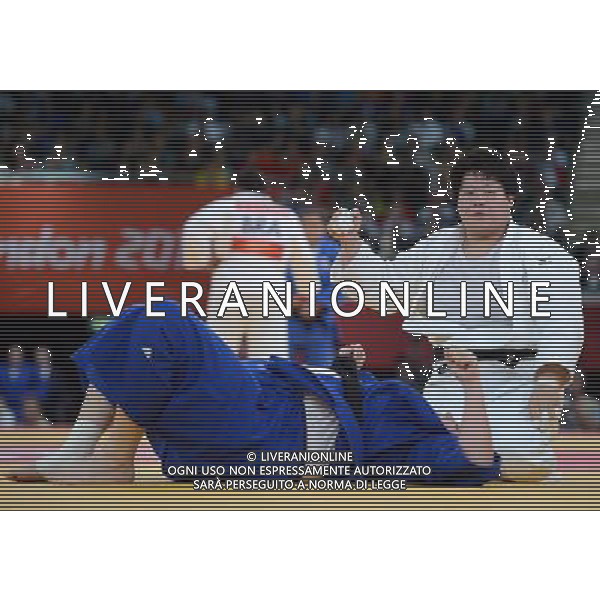 (120803) -- LONDON, Aug. 3, 2012 () -- Tong Wen of China (in white) competes with Urszula Sadkowska of Poland during women\'s Judo +78kg elimination round of 16 contest, at London 2012 Olympic Games in London, Britain, on August 3, 2012. Tong Wen of China won. (/Wang Qingqin) (nxl) ©PHOTOSHOT/Agenzia Aldo Liverani Sas - ITALY ONLY - GIOCHI OLIMPICI, OLIMPIADI LONDRA 2012