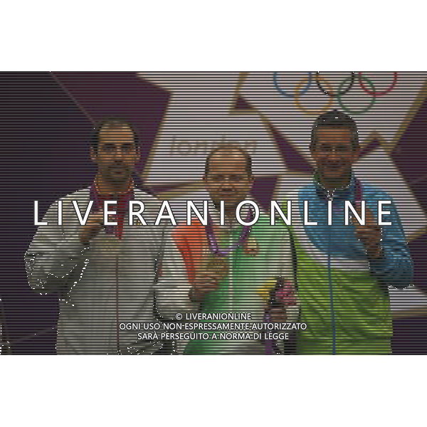 (120803) -- LONDON, Aug. 3, 2012 () -- Gold medalist Sergei Martynov of Belarus (C), silver medalist Lionel Cox of Belgium (L) and bronze medalist Rajmond Debevec of Slovenia pose for pictures during victory ceremony of men\'s shooting 50m rifle prone competition, at London 2012 Olympic Games in London, Britain, on August 3, 2012. (/Yin Gang) (nxl) ©PHOTOSHOT/Agenzia Aldo Liverani Sas - ITALY ONLY - GIOCHI OLIMPICI, OLIMPIADI LONDRA 2012