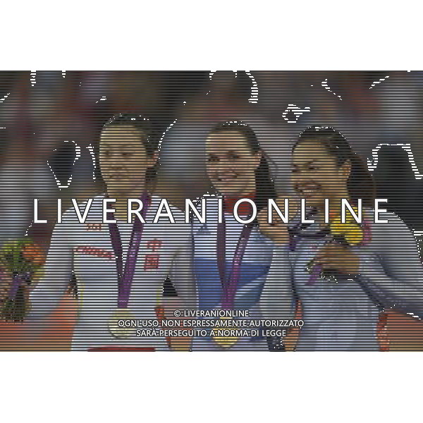 (120803) -- LONDON, Aug. 3, 2012 () -- Gold medalist Victoria Pendleton of Britain (C), Silver medalist Guo Shuang of China (L), and Bronze medalist Lee Wai Sze of Chinese Hong Kong celebrate at the awarding ceremony of women\'s Keirin competition of Cycling track event at London 2012 Olympic Games, London, Britain, Aug. 3, 2012. (/Li Ga) ©PHOTOSHOT/Agenzia Aldo Liverani Sas - ITALY ONLY - GIOCHI OLIMPICI, OLIMPIADI LONDRA 2012