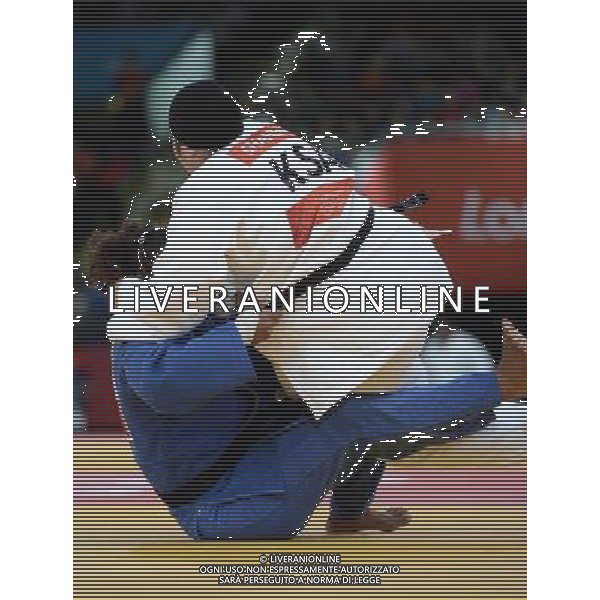 (120803) -- LONDON, Aug. 3, 2012 () -- Wojdan Shaherkani of Saudi Arabia (in white) competes with Melissa Mojica of Puerto Rico during women\'s Judo +78kg elimination round of 32 match, at London 2012 Olympic Games in London, Britain, on August 3, 2012. Wojdan Shaherkani is the first of Saudi Arabian women athletes to compete in the Olympic Games. (/Wang Qingqin) (nxl) ©PHOTOSHOT/Agenzia Aldo Liverani Sas - ITALY ONLY - GIOCHI OLIMPICI, OLIMPIADI LONDRA 2012