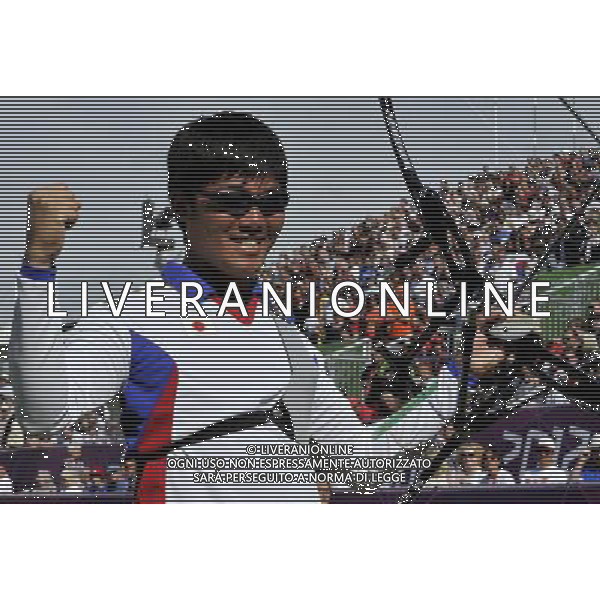 (120803) -- LONDON, Aug. 3, 2012 () -- Takaharu Furukawa of Japan celebrates a score during men\'s individual gold medal match of archery against Oh Jin Hyek of South Korea, at London 2012 Olympic Games in London, Britain, August 3, 2012. Takaharu Furukawa won silver medal. (/Gesang Dawa) (zgp) ©PHOTOSHOT/Agenzia Aldo Liverani Sas - ITALY ONLY - GIOCHI OLIMPICI, OLIMPIADI LONDRA 2012