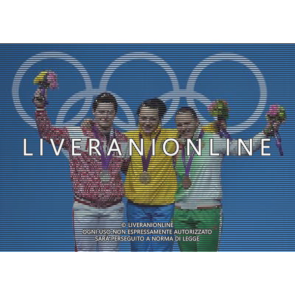 (120803) -- LONDON, Aug. 3, 2012 () -- Gold medalist Svetlana Podobedova of Kazakhstan (C), silver medalist Natalya Zabolotnaya of Russia (L), and bronze medalist Iryna Kulesha of Belarus celebrate at the awarding ceremony of women\'s 75kg weightlifting event at London 2012 Olympic Games, London, Britain, Aug. 3, 2012. (/Gong Lei) ©PHOTOSHOT/Agenzia Aldo Liverani Sas - ITALY ONLY - GIOCHI OLIMPICI, OLIMPIADI LONDRA 2012