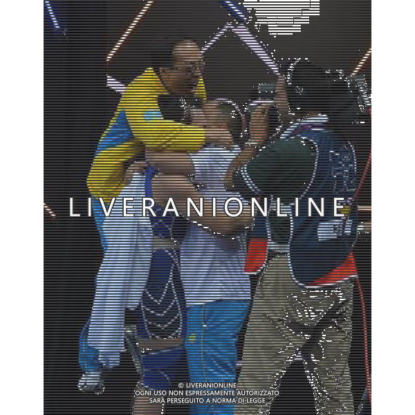 (120803) -- LONDON, Aug. 3, 2012 () -- Svetlana Podobedova of Kazakhstan is congratulated after finishing the women\'s 75kg weightlifting event at London 2012 Olympic Games, London, Britain, Aug. 3, 2012. Svetlana Podobedova claimed the gold medal of the event and set a new Olympic Record of clean and jerk of this event with a weight of 161kg. (/Gong Lei) ©PHOTOSHOT/Agenzia Aldo Liverani Sas - ITALY ONLY - GIOCHI OLIMPICI, OLIMPIADI LONDRA 2012