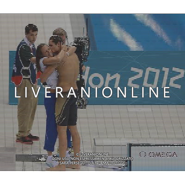 (120803) -- LONDON, Aug. 3, 2012 () -- Florent Manaudou of France hugs his sister after men¡¯s 50m freestyle final of swimming competition, at London 2012 Olympic Games in London, Britain, August 3, 2012. Florent Manaudou of France won gold medal with 21.34.(/Li Gang) (zgp) ©PHOTOSHOT/Agenzia Aldo Liverani Sas - ITALY ONLY - GIOCHI OLIMPICI, OLIMPIADI LONDRA 2012