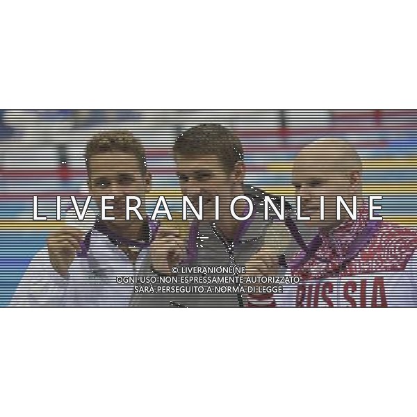 Chad le Clos (South Africa) Silver medalist, Michael Phelps USA winner of the Mens 100m butterfly with Evgeny Korotyshkin (Russia) Silver medalist. Aquatics Centre, Olympic Park. London ©PHOTOSHOT/Agenzia Aldo Liverani Sas - ITALY ONLY - GIOCHI OLIMPICI, OLIMPIADI LONDRA 2012