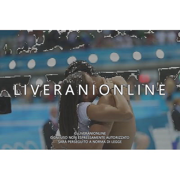 (120803) -- LONDON, Aug. 3, 2012 () -- Florent Manaudou of France hugs his sister after men¡¯s 50m freestyle final of swimming competition, at London 2012 Olympic Games in London, Britain, August 3, 2012. Florent Manaudou of France won gold medal with 21.34.(/Fei Maohua) (zgp) ©PHOTOSHOT/Agenzia Aldo Liverani Sas - ITALY ONLY - GIOCHI OLIMPICI, OLIMPIADI LONDRA 2012