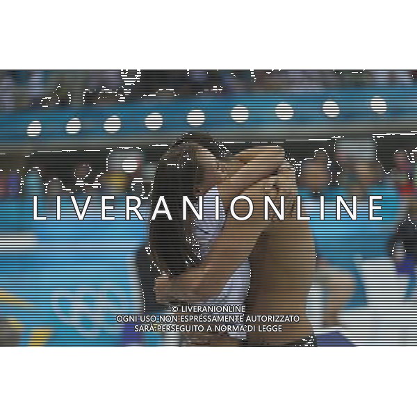 (120803) -- LONDON, Aug. 3, 2012 () -- Florent Manaudou of France hugs his sister after men¡¯s 50m freestyle final of swimming competition, at London 2012 Olympic Games in London, Britain, August 3, 2012. Florent Manaudou of France won gold medal with 21.34.(/Fei Maohua) (zgp) ©PHOTOSHOT/Agenzia Aldo Liverani Sas - ITALY ONLY - GIOCHI OLIMPICI, OLIMPIADI LONDRA 2012