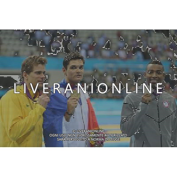 (120803) -- LONDON, Aug. 3, 2012 () -- Gold medalist Florent Manaudou (C) of France, silver medalist Cullen Jones (R) of U.S., and bronze medalist Cesar Cielo of Brazil attend awarding ceremony of men¡¯s 50m freestyle final of swimming competition, at London 2012 Olympic Games in London, Britain, August 3, 2012. (/Fei Maohua) (zgp) ©PHOTOSHOT/Agenzia Aldo Liverani Sas - ITALY ONLY - GIOCHI OLIMPICI, OLIMPIADI LONDRA 2012