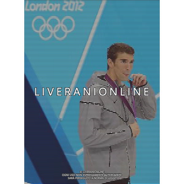 (120803) -- LONDON, Aug. 3, 2012 () -- Michael Phelps of U.S. attends awarding ceremony of men¡¯s 100m butterfly final of swimming competition, at London 2012 Olympic Games in London, Britain, August 3, 2012. Michael Phelps won gold medal with 51.21.(/Fan Jun) (zgp) ©PHOTOSHOT/Agenzia Aldo Liverani Sas - ITALY ONLY - GIOCHI OLIMPICI, OLIMPIADI LONDRA 2012