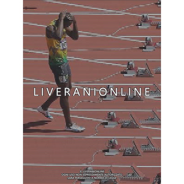 (120804) -- LONDON, Aug. 4, 2012 () -- Usain Bolt of Jamaica prepares for the start prior to the men\'s 100m round 1 heats at London 2012 Olympic Games, London, Britain, Aug. 4, 2012. Usain Bolt was qualified for the semifinal with a time of 10.09 seconds. (/Li Ming) ©PHOTOSHOT/Agenzia Aldo Liverani Sas - ITALY ONLY - GIOCHI OLIMPICI, OLIMPIADI LONDRA 2012