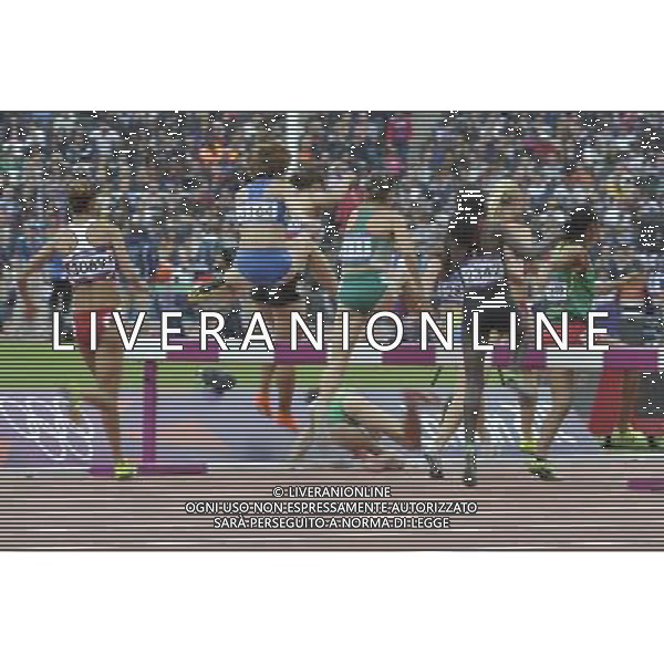Female athlete falls in the womens 3000m steeplechase chase, Olympic Stadium, Stratford. London ©PHOTOSHOT/Agenzia Aldo Liverani Sas - ITALY ONLY - GIOCHI OLIMPICI, OLIMPIADI LONDRA 2012