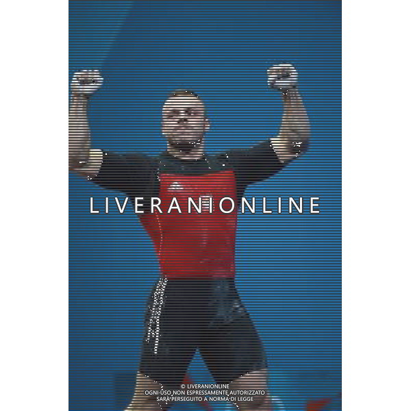 (120803) -- LONDON, Aug. 3, 2012 () -- Adrian Edward Zielinski of Poland celebrates during men\'s 85kg weightlifting event at London 2012 Olympic Games, London, Britain, Aug. 3, 2012. Adrian Edward Zielinski claimed the gold medal of the event with a total of 385kg. (/Guo Yong) ©PHOTOSHOT/Agenzia Aldo Liverani Sas - ITALY ONLY - GIOCHI OLIMPICI, OLIMPIADI LONDRA 2012