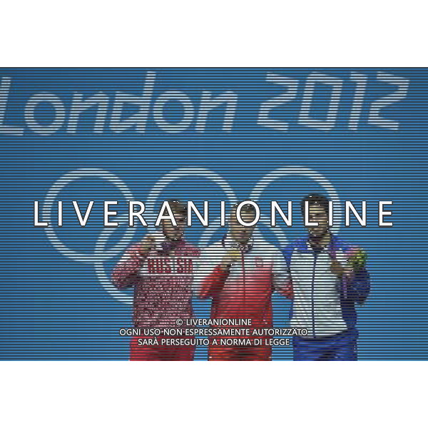 (120803) -- LONDON, Aug. 3, 2012 () -- Gold medalist Adrian Edward Zielinski of Poland (C), silver medalist Apti Aukhadov of Russia (L), and bronze medalist Kianoush Rostami of Iran celebrate at the awarding ceremony of men\'s 85kg weightlifting event at London 2012 Olympic Games, London, Britain, Aug. 3, 2012. (/Gong Lei) ©PHOTOSHOT/Agenzia Aldo Liverani Sas - ITALY ONLY - GIOCHI OLIMPICI, OLIMPIADI LONDRA 2012