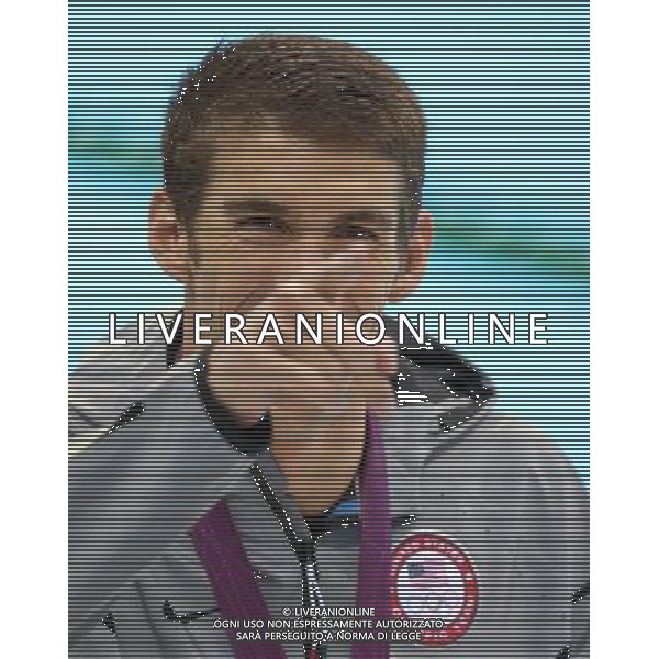 (120803) -- LONDON, Aug. 3, 2012 () -- Michael Phelps of U.S. reacts at awarding ceremony of men¡¯s 100m butterfly of swimming competition, at London 2012 Olympic Games in London, Britain, August 3, 2012. Michael Phelps won gold medal with 51.21.(/Fan Jun) (zgp) ©PHOTOSHOT/Agenzia Aldo Liverani Sas - ITALY ONLY - GIOCHI OLIMPICI, OLIMPIADI LONDRA 2012