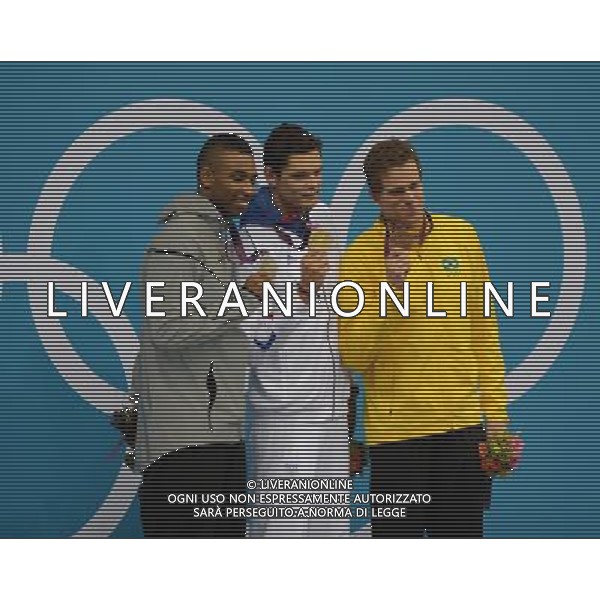 (120803) -- LONDON, Aug. 3, 2012 () -- Gold medalist Florent Manaudou (C) of France, silver medalist Cullen Jones (L) of U.S., and bronze medalist Cesar Cielo of Brazil attend awarding ceremony of men¡¯s 50m freestyle final of swimming competition, at London 2012 Olympic Games in London, Britain, August 3, 2012. (/Fei Maohua) (zgp) ©PHOTOSHOT/Agenzia Aldo Liverani Sas - ITALY ONLY - GIOCHI OLIMPICI, OLIMPIADI LONDRA 2012