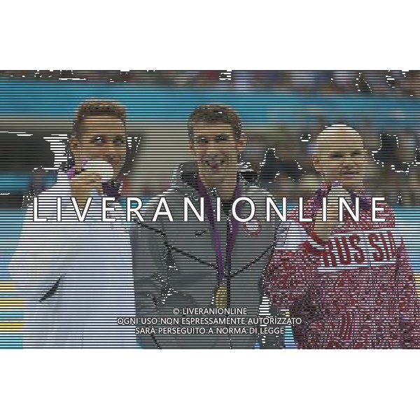 (120803) -- LONDON, Aug. 3, 2012 () -- Gold medalist Michael Phelps (C) of U.S., silver medalist Chad le Clos (L) of South Africa, Bronze medalist Evgeny Korotyshkin of Russia attend awarding ceremony of men¡¯s 100m butterfly of swimming competition, at London 2012 Olympic Games in London, Britain, August 3, 2012. (/Fei Maohua) (zgp) ©PHOTOSHOT/Agenzia Aldo Liverani Sas - ITALY ONLY - GIOCHI OLIMPICI, OLIMPIADI LONDRA 2012