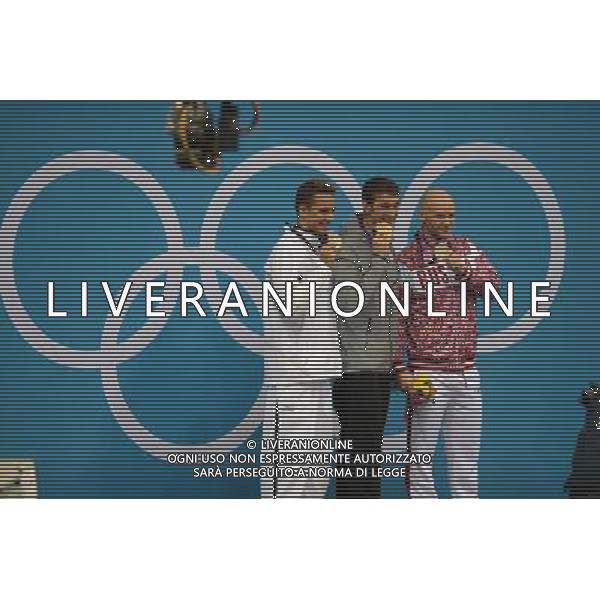 (120803) -- LONDON, Aug. 3, 2012 () -- Gold medalist Michael Phelps (C) of U.S., silver medalist Chad le Clos (L) of South Africa, Bronze medalist Evgeny Korotyshkin of Russia attend awarding ceremony of men¡¯s 100m butterfly of swimming competition, at London 2012 Olympic Games in London, Britain, August 3, 2012. (/Fei Maohua) (zgp) ©PHOTOSHOT/Agenzia Aldo Liverani Sas - ITALY ONLY - GIOCHI OLIMPICI, OLIMPIADI LONDRA 2012