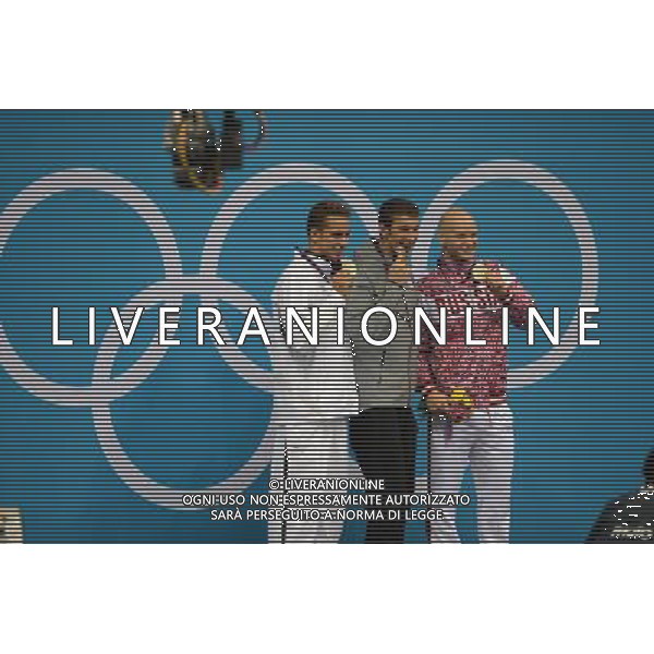 (120803) -- LONDON, Aug. 3, 2012 () -- Gold medalist Michael Phelps (C) of U.S., silver medalist Chad le Clos (L) of South Africa, Bronze medalist Evgeny Korotyshkin of Russia attend awarding ceremony of men¡¯s 100m butterfly of swimming competition, at London 2012 Olympic Games in London, Britain, August 3, 2012. (/Fei Maohua) (zgp) ©PHOTOSHOT/Agenzia Aldo Liverani Sas - ITALY ONLY - GIOCHI OLIMPICI, OLIMPIADI LONDRA 2012