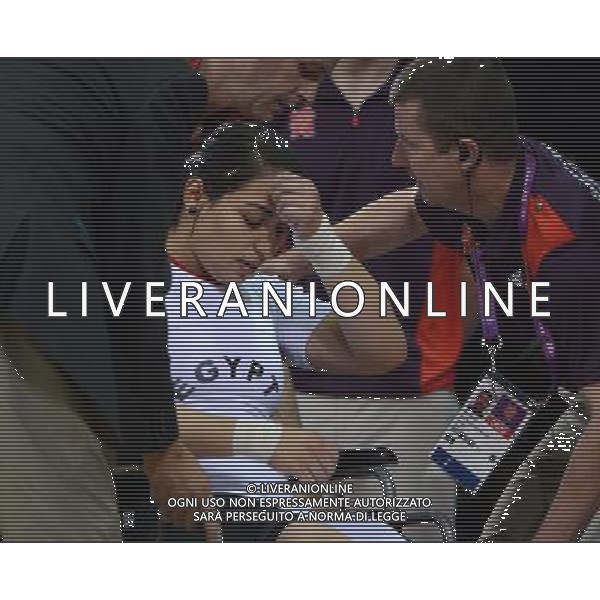 (120803) -- LONDON, Aug. 3, 2012 () -- Khalil Mahmoud K Abir Abdelrahman of Egypt is taken away on a wheel chair after injured during the women\'s 75kg weightlifting event at London 2012 Olympic Games, London, Britain, Aug. 3, 2012. Khalil Mahmoud K Abir Abdelrahman of Egypt ranked the 5th of the event. (/Guo Yong) ©PHOTOSHOT/Agenzia Aldo Liverani Sas - ITALY ONLY - GIOCHI OLIMPICI, OLIMPIADI LONDRA 2012