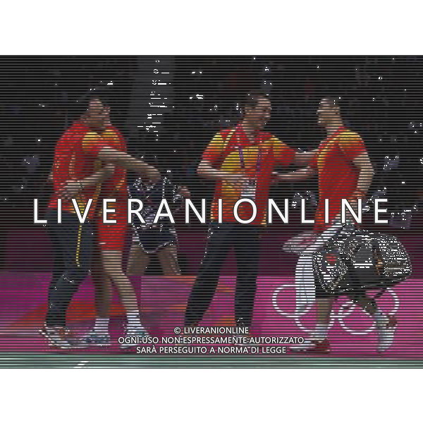 (120804) -- LONDON, Aug. 4, 2012 () -- China\'s Cai Yun/Fu Haifeng celebrate with their coach during men\'s doubles semifinal of badminton against Koo Kien Keat/Tan Boon Heong of Malaysia, at London 2012 Olympic Games in London, Britain, August 4, 2012. The Chinese players won the match 2-0. (/Tang Shi) (zgp) ©PHOTOSHOT/Agenzia Aldo Liverani Sas - ITALY ONLY - GIOCHI OLIMPICI, OLIMPIADI LONDRA 2012