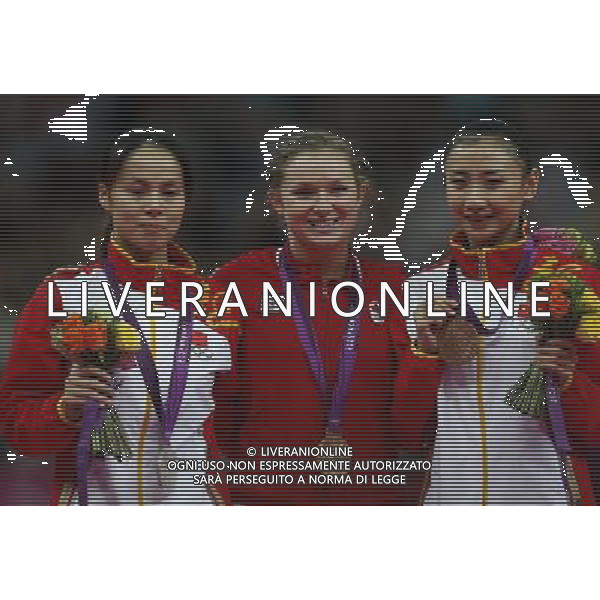 (120804) -- LONDON, Aug. 4, 2012 () -- Gold medalist Rosannagh Maclennan (C) of Canada, silver medalist Huang Shanshan (L) of China, bronze medalist He Wenna of China attend awarding ceremony of women\'s trampoline competition at the London 2012 Olympic Games in London, Britain, Aug. 4, 2012. (/Shen Bohan)(zgp) ©PHOTOSHOT/Agenzia Aldo Liverani Sas - ITALY ONLY - GIOCHI OLIMPICI, OLIMPIADI LONDRA 2012