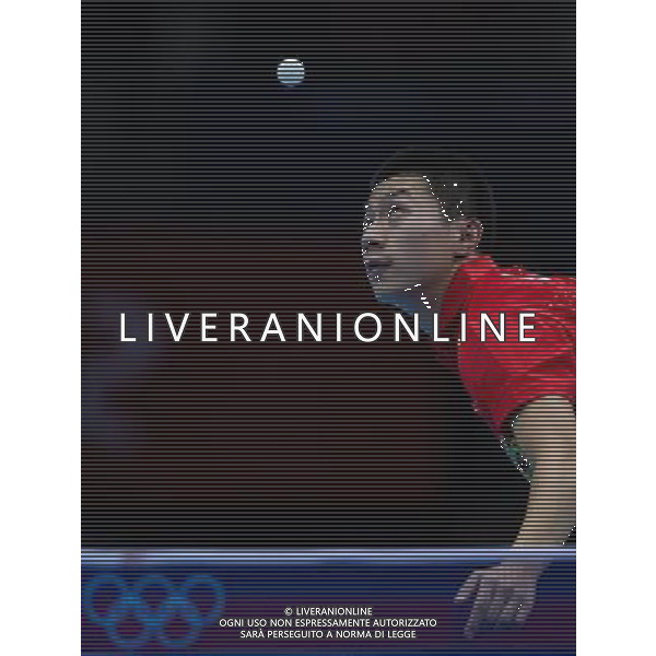 (120803) -- LONDON, Aug. 3, 2012 () -- China\'s Ma Long serves the ball during men\'s team contest of table tennis between Russia and China, at London 2012 Olympic Games in London, Britain, on August 4, 2012. China won the match 3-1. (/Jin Liwang) (zgp) ©PHOTOSHOT/Agenzia Aldo Liverani Sas - ITALY ONLY - GIOCHI OLIMPICI, OLIMPIADI LONDRA 2012