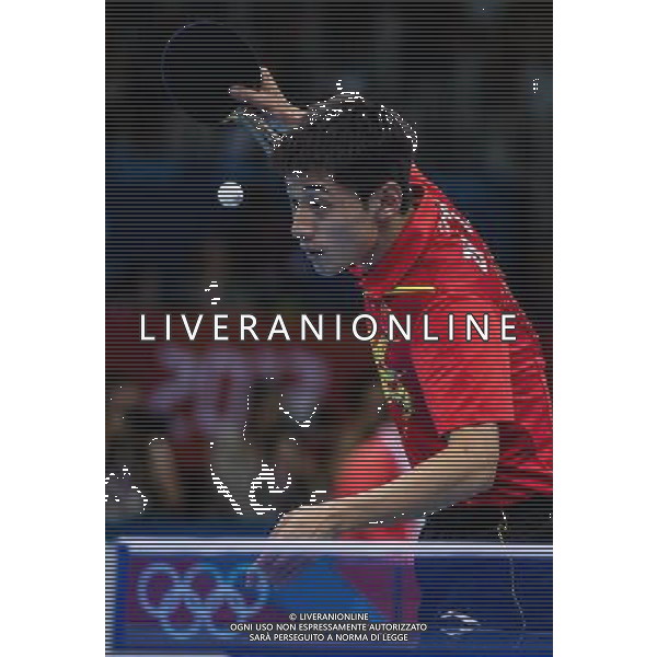 (120803) -- LONDON, Aug. 3, 2012 () -- China\'s Zhang Jike serves the ball during men\'s team contest of table tennis between Russia and China, at London 2012 Olympic Games in London, Britain, on August 4, 2012. China won the match 3-1. (/Jin Liwang) (zgp) ©PHOTOSHOT/Agenzia Aldo Liverani Sas - ITALY ONLY - GIOCHI OLIMPICI, OLIMPIADI LONDRA 2012