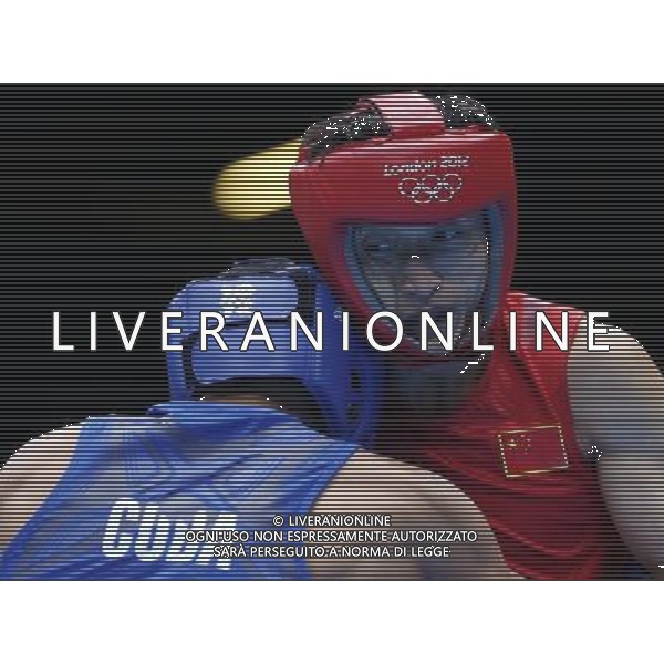 (120804) -- LONDON, Aug. 4, 2012 () -- China\'s Zou Shiming (R) competes with Yosbany Veitia Soto of Cuba during men\'s light fly of boxing competition at London 2012 Olympic Games in London, Britain, August 4, 2012. Zou Shiming won the match and advanced to quarterfinal. (/Wang Shen) (zgp) ©PHOTOSHOT/Agenzia Aldo Liverani Sas - ITALY ONLY - GIOCHI OLIMPICI, OLIMPIADI LONDRA 2012