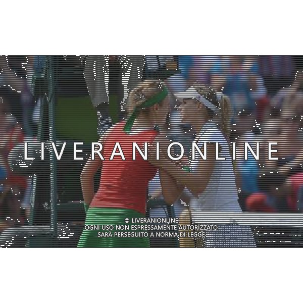 (120804) -- LONDON, Aug. 4, 2012 () -- Victoria Azarenka of Belarus (L) interacts with Maria Kirilenko of Russia during women\'s tennis singles bronze medal match, at London 2012 Olympic Games in London, Britain, on August 4, 2012. Victoria Azarenka of Belarus defeated Maria Kirilenko of Russia 2-0. (/Li Gang) (nxl) ©PHOTOSHOT/Agenzia Aldo Liverani Sas - ITALY ONLY - GIOCHI OLIMPICI, OLIMPIADI LONDRA 2012