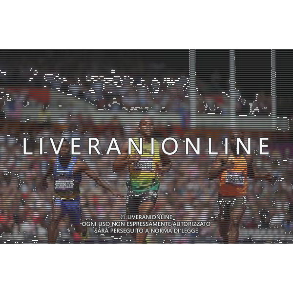 (120804) -- LONDON, Aug. 4, 2012 () -- Asafa Powell of Jamaica (C) competes during the men\'s 100m round 1 heats at London 2012 Olympic Games, London, Britain, Aug. 4, 2012. Asafa Powell was qualified for the semifinal with a time of 10.04 seconds. (/Liao Yujie) ©PHOTOSHOT/Agenzia Aldo Liverani Sas - ITALY ONLY - GIOCHI OLIMPICI, OLIMPIADI LONDRA 2012
