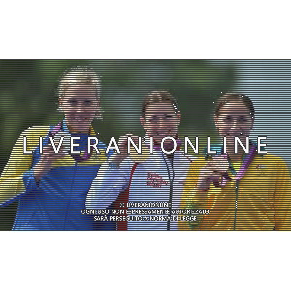 (120804) -- LONDON, Aug. 4, 2012 () -- Gold medalist Nicola Spirig (C) of Switzerland, silver medalist Lisa Norden (L) of Sweden, and bronze medalist Erin Densham of Australia attend awarding ceremony of women\'s triathlon competition at London 2012 Olympic Games in London, Britain, August 4, 2012.(/Gesang Dawa) (zgp) ©PHOTOSHOT/Agenzia Aldo Liverani Sas - ITALY ONLY - GIOCHI OLIMPICI, OLIMPIADI LONDRA 2012