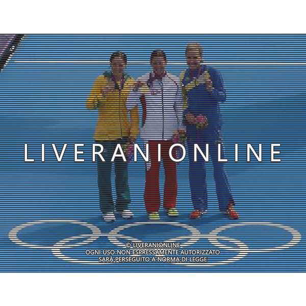 (120804) -- LONDON, Aug. 4, 2012 () -- Gold medalist Nicola Spirig (C) of Switzerland, silver medalist Lisa Norden (L) of Sweden, and bronze medalist Erin Densham of Australia attend awarding ceremony of women\'s triathlon competition at London 2012 Olympic Games in London, Britain, August 4, 2012.(/Wang Yuguo) (zgp) ©PHOTOSHOT/Agenzia Aldo Liverani Sas - ITALY ONLY - GIOCHI OLIMPICI, OLIMPIADI LONDRA 2012