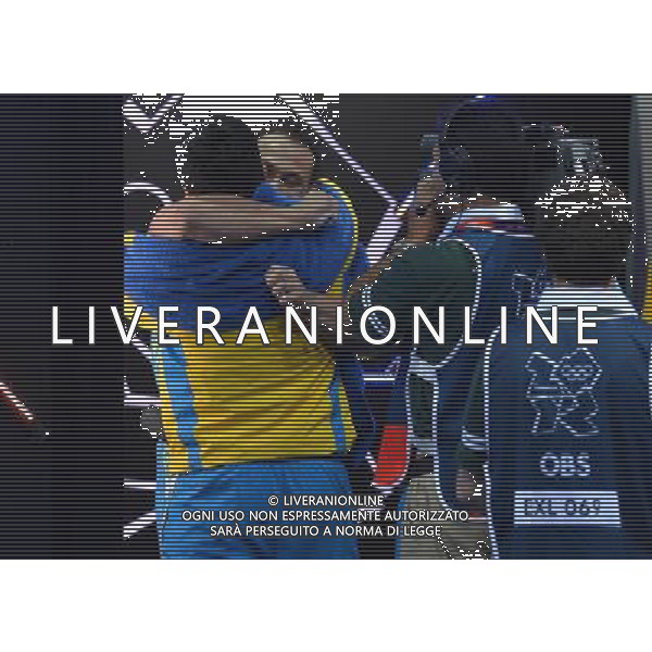 (120804) -- LONDON, Aug. 4, 2012 () -- Ilya Ilyin of Kazakhstan hugs his coach after winning in men\'s weightlifting 94kg contest, at London 2012 Olympic Games in London, Britain, on August 4, 2012. Ilya Ilyin of Kazakhstan won gold medal. (/Gong Lei) (nxl) ©PHOTOSHOT/Agenzia Aldo Liverani Sas - ITALY ONLY - GIOCHI OLIMPICI, OLIMPIADI LONDRA 2012