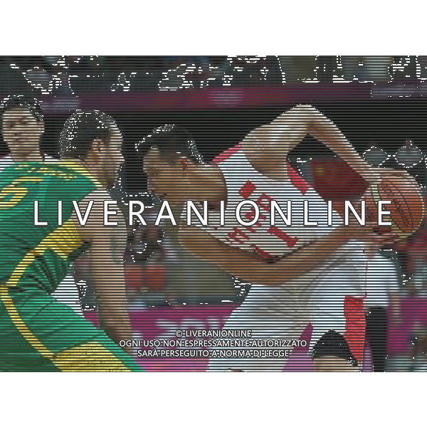 (120804) -- LONDON, Aug. 4, 2012 () -- Yi Jianlian of China (in white) competes during men\'s basketball preliminary round group B match between China and Brazil, at London 2012 Olympic Games in London, Britain, on August 4, 2012. Brazil won 98-59. (/Meng Yongmin) (nxl) ©PHOTOSHOT/Agenzia Aldo Liverani Sas - ITALY ONLY - GIOCHI OLIMPICI, OLIMPIADI LONDRA 2012