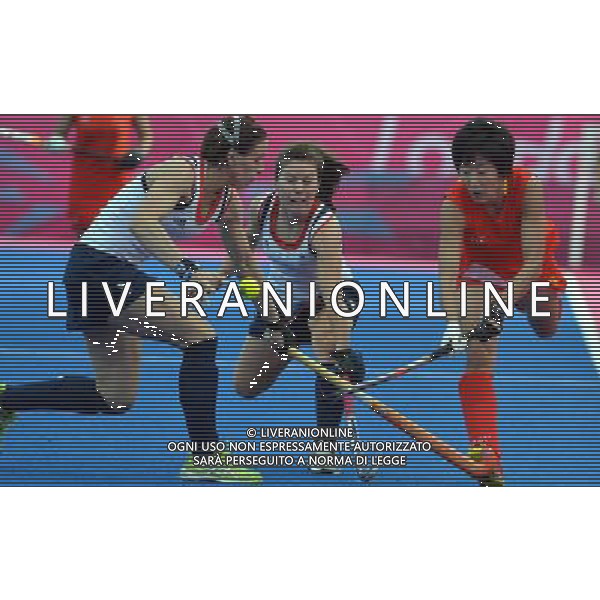 (120804) -- LONDON, Aug. 4, 2012 () -- Gao Lihua (R) of China vies for the ball during the women\'s preliminary round group A match of Hockey between China and Britain at London 2012 Olympic Games, London, Britain, Aug. 4, 2012. China won the match 2-1. (/Gesang Dawa) ©PHOTOSHOT/Agenzia Aldo Liverani Sas - ITALY ONLY - GIOCHI OLIMPICI, OLIMPIADI LONDRA 2012