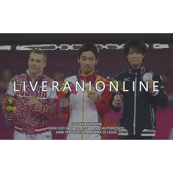 (120805) -- LONDON, Aug. 5, 2012 () -- Gold medalist Zou Kai of China (C), silver medalist Kohei Uchimura of Japan (R) and bronze medalist Denis Ablyazin of Russia attend victory ceremony of men\'s floor exercise contest of gymnastics artistic event, at London 2012 Olympic Games in London, Britain, on August 5, 2012. (/Cheng Min) (nxl) /PHOTOSHOT/AG ALDO LIVERANI SAS - ITALY ONLY -