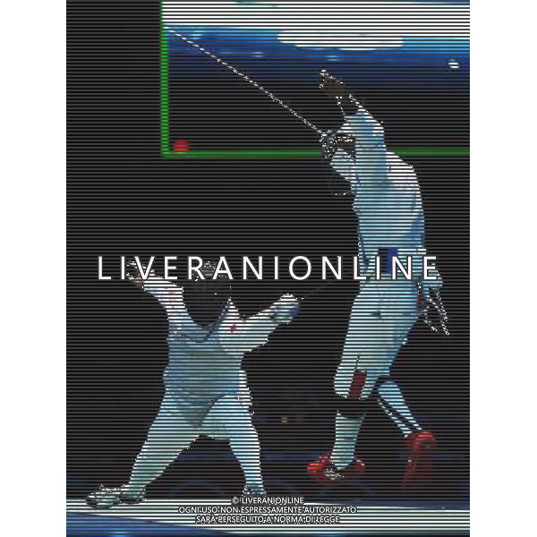 (120805) -- LONDON, Aug. 5, 2012 () -- Zhang Liangliang of China (L) competes during men\'s fencing foil team placement 7-8 contest between China and France, at London 2012 Olympic Games in London, Britain, on August 5, 2012. China won 45-33. (/Jin Liwang) (nxl) /PHOTOSHOT/AG ALDO LIVERANI SAS - ITALY ONLY -