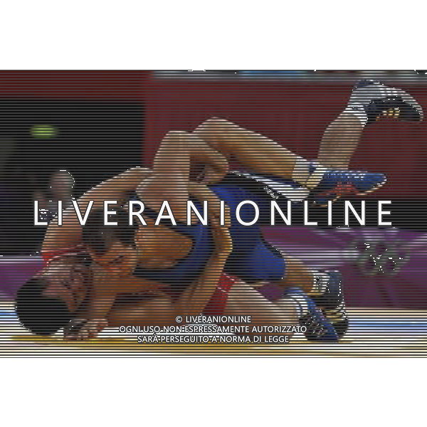 (120805) -- LONDON, Aug. 5, 2012 () -- Roman Vlasov of Russia (red) competes with Arsen Julfalakyan of Armenia during the men\'s wrestling greco-roman 74kg gold medal contest, at London 2012 Olympic Games in London, Britain, on August 5, 2012. Roman Vlasov of Russia won the gold medal of the event. (/Gesang Dawa) /PHOTOSHOT/AG ALDO LIVERANI SAS - ITALY ONLY -
