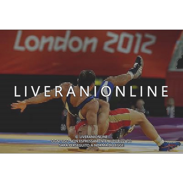 (120805) -- LONDON, Aug. 5, 2012 () -- Roman Vlasov of Russia (red) competes with Arsen Julfalakyan of Armenia during the men\'s wrestling greco-roman 74kg gold medal contest, at London 2012 Olympic Games in London, Britain, on August 5, 2012. Roman Vlasov of Russia won the gold medal of the event. (/Gesang Dawa) /PHOTOSHOT/AG ALDO LIVERANI SAS - ITALY ONLY -