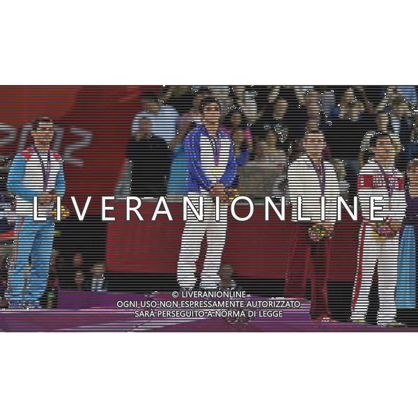 (120805) -- LONDON, Aug. 5, 2012 () -- Gold medalist Hamid Mohammad Soryan Reihanpour of Iran (2nd L), silver medalist Rovshan Bayramov of Azerbaijan (1st L), and bronze medalists Peter Modos of Hungary (2nd R) and Mingiyan Semenov of Russia pose at the awarding ceremony of men\'s wrestling greco-roman 55kg event, at London 2012 Olympic Games in London, Britain, on August 5, 2012. (/Gesang Dawa) /PHOTOSHOT/AG ALDO LIVERANI SAS - ITALY ONLY -