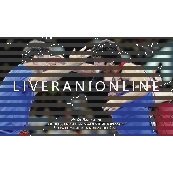 (120805) -- LONDON, Aug. 5, 2012 () -- Hamid Mohammad Soryan Reihanpour of Iran (in red) celebrates after winning in men\'s wrestling greco-roman 55kg gold medal contset, at London 2012 Olympic Games in London, Britain, on August 5, 2012. Hamid Mohammad Soryan Reihanpour of Iran won gold medal. (/Gesang Dawa) (nxl) /PHOTOSHOT/AG ALDO LIVERANI SAS - ITALY ONLY -