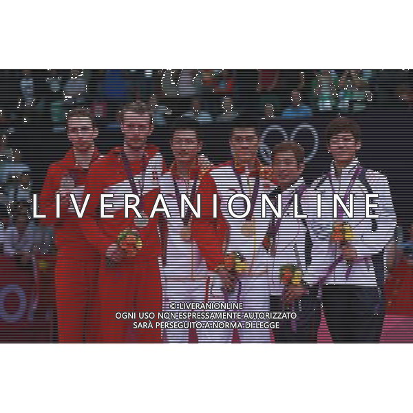 (120805) -- LONDON, Aug. 5, 2012 () -- Gold medalists Fu Haifeng (3rd R)/Cai Yun of China, silver medalists Mathias Boe (1st L)/Carsten Mogensen of Denmark, and bronze medalists Chung Jae Sung/Lee Yong Dae (1st R) pose at awarding ceremony of men\'s badminton doubles, at London 2012 Olympic Games in London, Britain, August 5, 2012. (/Ren Zhenglai) (zgp) /PHOTOSHOT/AG ALDO LIVERANI SAS - ITALY ONLY -