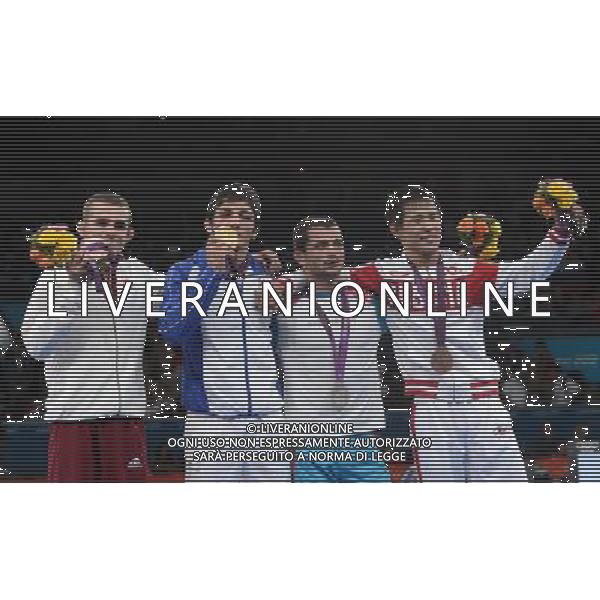 (120805) -- LONDON, Aug. 5, 2012 () -- Gold medalist Hamid Mohammad Soryan Reihanpour of Iran (2nd L), silver medalist Rovshan Bayramov of Azerbaijan (2nd R) and bronze medalists Peter Modos of Hungary (1st L) and Mingiyan Semenov of Russia attend victory ceremony of men\'s wrestling greco-roman 55kg contest, at London 2012 Olympic Games in London, Britain, on August 5, 2012. (/Li Gang) (nxl) /PHOTOSHOT/AG ALDO LIVERANI SAS - ITALY ONLY -