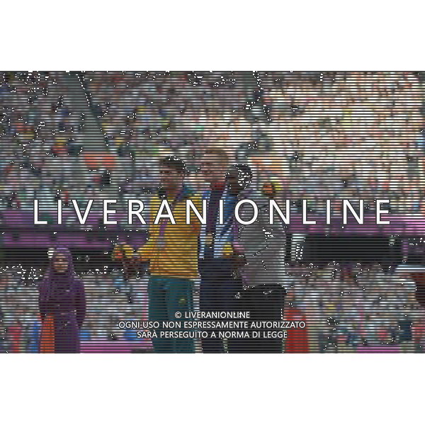 (120805) -- LONDON, Aug. 5, 2012 () -- Gold medalist Greg Rutherford of Britain (C), silver medalist Mitchell Watt of Australia (L) and bronze medalist Will Claye of USA attend victory ceremony of men\'s long jump contest, at London 2012 Olympic Games in London, Britain, on August 5, 2012. (/Yang Lei) (nxl) /PHOTOSHOT/AG ALDO LIVERANI SAS - ITALY ONLY -