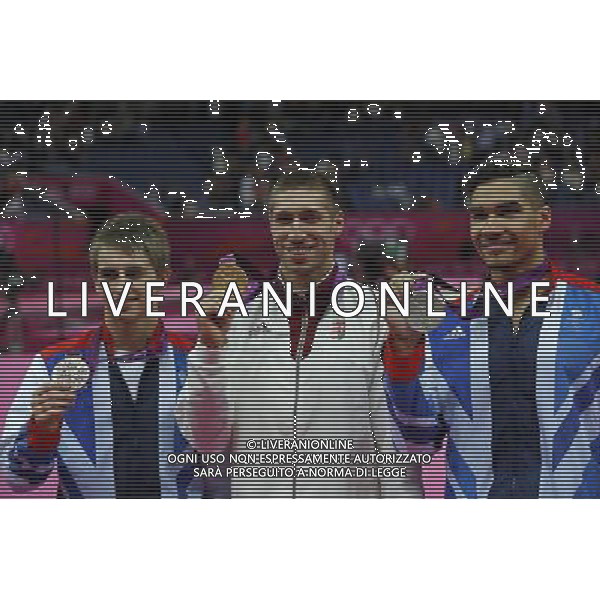 (120805) -- LONDON, Aug. 5, 2012 () -- Gold medalist Krisztian Berki of Hungary (C), silver medalist Louis Smith of Britain (R) and bronze medalist Max Whitlock of Britain attend victory ceremony of men\'s pommel horse contest of Gymnastics Artistic event, at London 2012 Olympic Games in London, Britain, on August 5, 2012. (/Shen Bohan) (nxl) /PHOTOSHOT/AG ALDO LIVERANI SAS - ITALY ONLY -