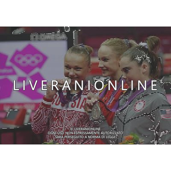 (120805) -- LONDON, Aug. 5, 2012 () -- Gold medalist Sandra Raluca Izbasa of Romania (C), silver medalist Mc Kayla Maroney of USA (R) and bronze medalist Maria Paseka of Russia attend victory ceremony of women\'s vault contest of gymnastics artistic event, at London 2012 Olympic Games in London, Britain, on August 5, 2012. (/shen bohan) (nxl) /PHOTOSHOT/AG ALDO LIVERANI SAS - ITALY ONLY -