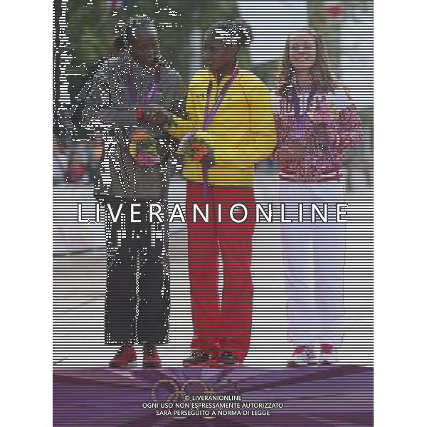 (120805) -- LONDON, Aug. 5, 2012 () -- Gold medalist Tiki Gelana (C) of Ethitopia, silver medalist Priscah Jeptoo (L) of Kenya, bronze medalist Tatyana Petrova Arkhipova of Russia attend awarding ceremony of women\'s marathon at London 2012 Olympic Games in London, Britain, August 5, 2012. (/Wang Lili) (zgp) /PHOTOSHOT/AG ALDO LIVERANI SAS - ITALY ONLY -
