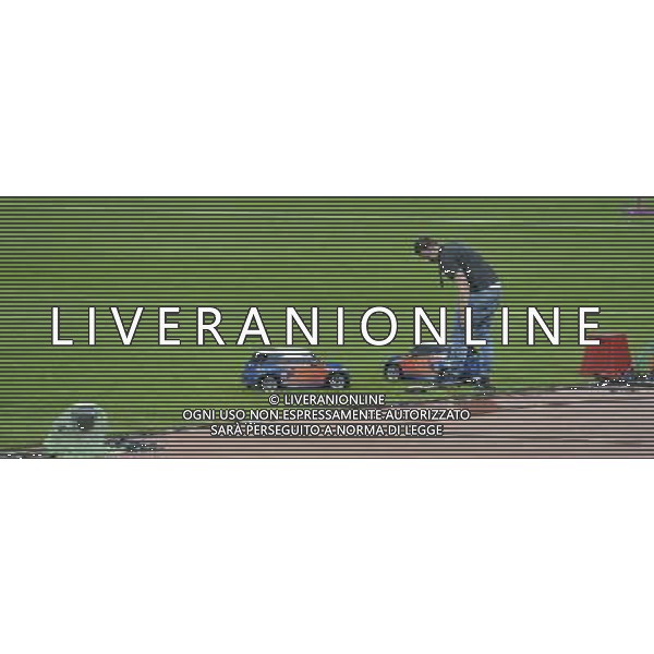 Operator with remote control mini cars which retrieve the Discus,javelins and hammers during competitions . Olympic Stadium, Olympic Park, Stratford. London AG ALDO LIVERANI S A S ONLY ITALY