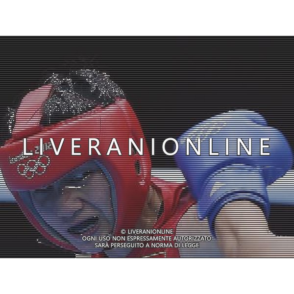 (120806) -- LONDON, Aug. 6, 2012 () -- Dong Cheng of China (red) competes with Mavzuna Chorieva of Russia during the quarterfinal match of women\'s light (60kg) Boxing event at London 2012 Olympic Games, London, Britain, Aug. 6, 2012. Dong Cheng lost the match 8-13. (/Wang Shen) AG ALDO LIVERANI S A S ONLY ITALY