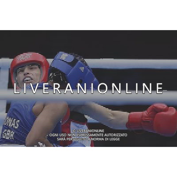 (120806) -- LONDON, Aug. 6, 2012 () -- Katie Taylor of Ireland (red) competes with Natasha Jonas of Britain during the quarterfinal match of women\'s light (60kg) Boxing event at London 2012 Olympic Games, London, Britain, Aug. 6, 2012. Katie Taylor won the match 26-15. (/Wang Shen) AG ALDO LIVERANI S A S ONLY ITALY